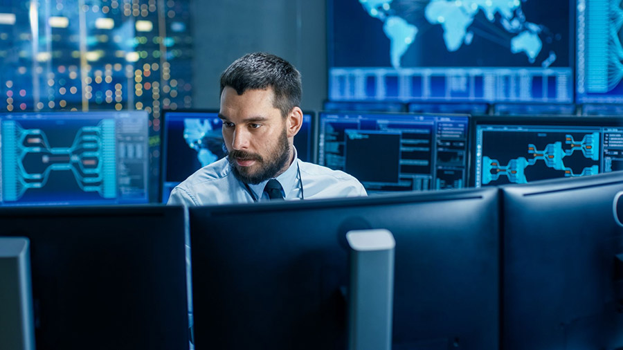 it security man working with multiple screens