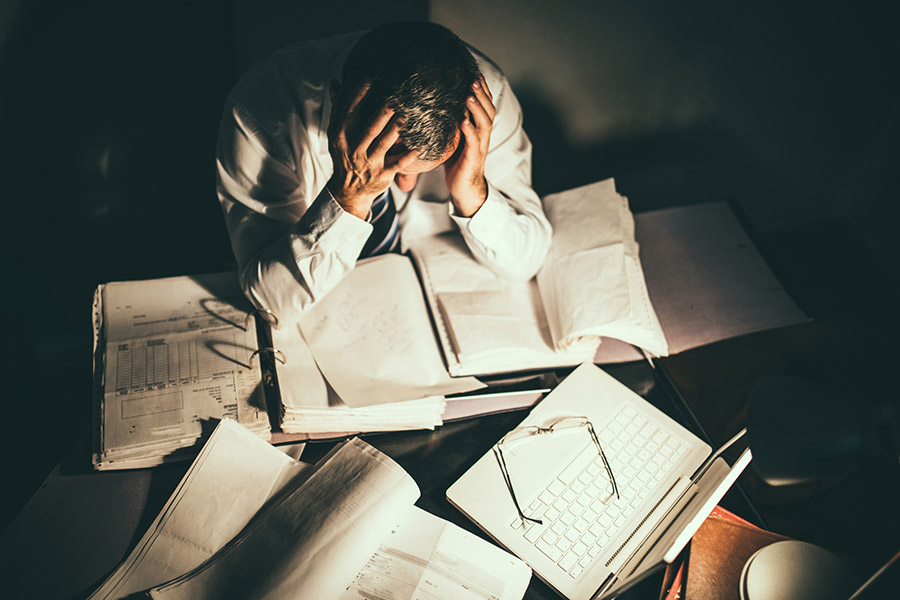 man worried at the office with documents