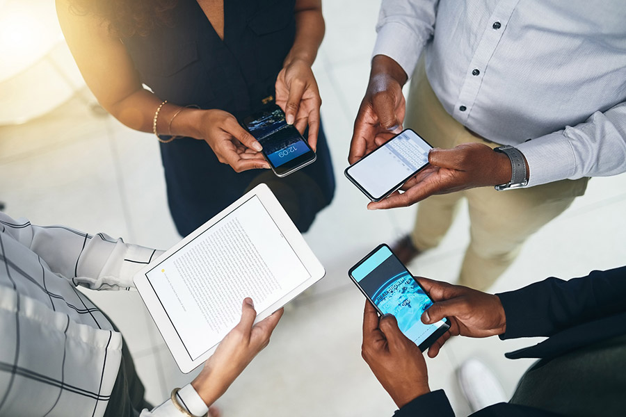 team with phones during meeting